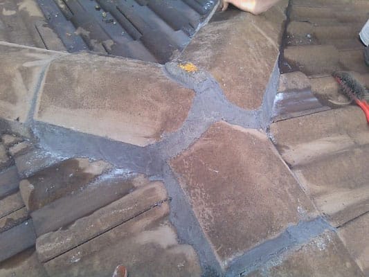 Roof valley repair with cement pointing and tile sealing by Dr Roof NZ to prevent leaks and water damage.